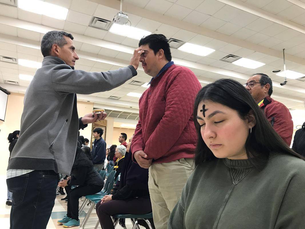  Father Leo Tiburcio, pastor of Our Lady of Guadalupe in Charlotte celebrated Mass at 6 a.m. on Ash Wednesday assisted by Deacon Eduardo Bernal. (Photos by Cesar Hurtado) 