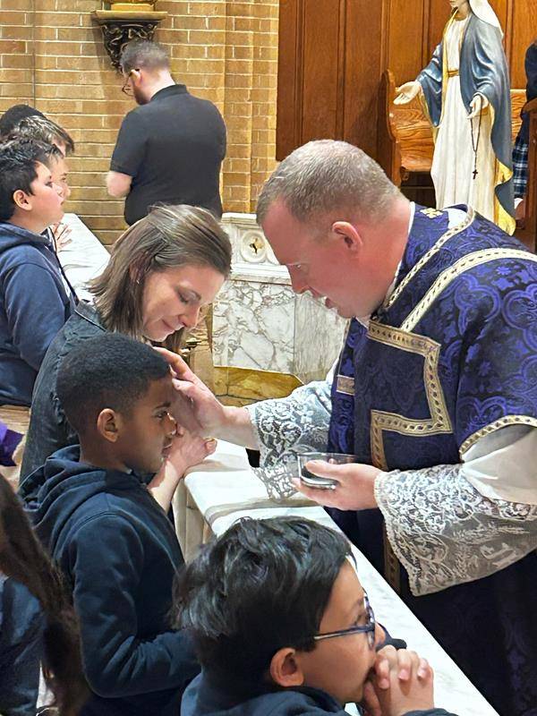 Students at Our Lady of Grace School in Greensboro receive ashes in a Mass celebrated by Father Casey Coleman. (Photos by Annie Ferguson.) at Our Lady of Grace School receive ashes. (Photos by Annie Ferguson.) 
