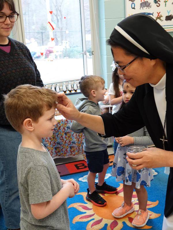 Preschool students at St. Mark School receive ashes on Feb. 22. (Photos by Amy Burger) 
