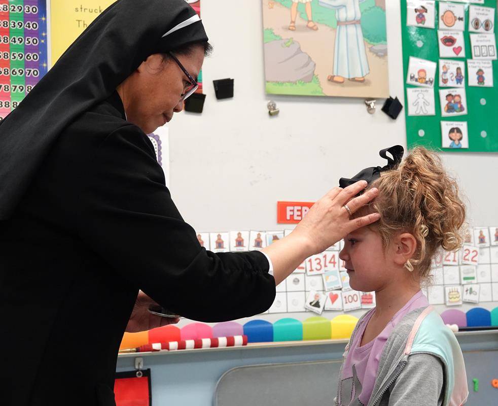 Preschool students at St. Mark School receive ashes on Feb. 22. (Photos by Amy Burger) 