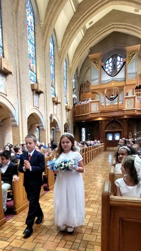 Our Lady of Grace School students celebrated second grade students who received their First Communion last weekend during their May 17 school Mass and crowned Mary. (Provided photos) 