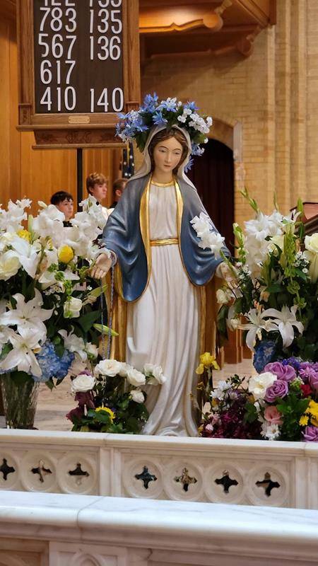 Our Lady of Grace School students celebrated second grade students who received their First Communion last weekend during their May 17 school Mass and crowned Mary. (Provided photos) 