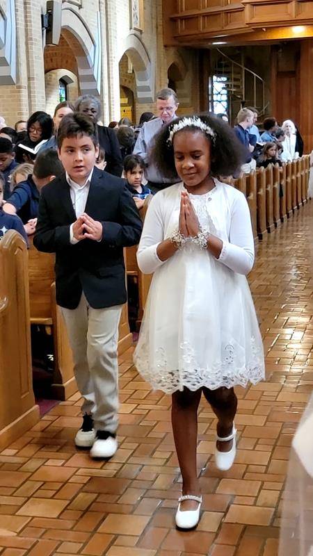 Our Lady of Grace School students celebrated second grade students who received their First Communion last weekend during their May 17 school Mass and crowned Mary. (Provided photos) 