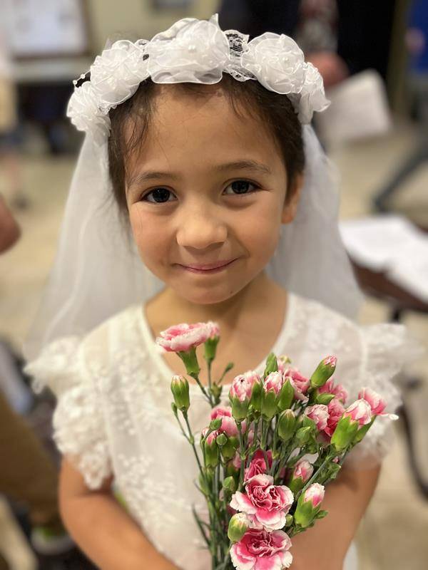 Second grade students at Sacred Heart School in Salisbury lead the all-school Mass and also adorned our Mother, Mary with flowers. (Provided photos) 