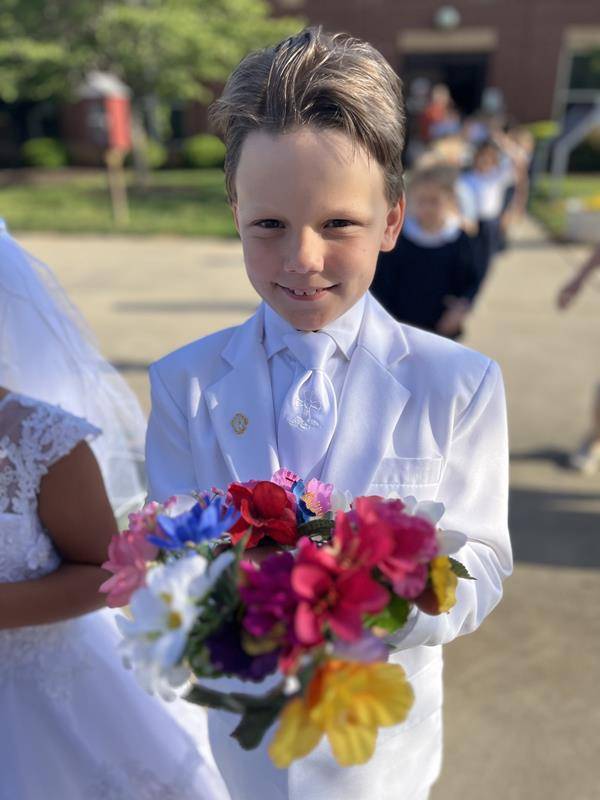 Second grade students at Sacred Heart School in Salisbury lead the all-school Mass and also adorned our Mother, Mary with flowers. (Provided photos) 
