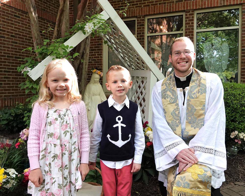 Preschoolers at St. Mark School in Huntersville honored Mary with flowers May 5. Clara Pfister and Owen DeLong crowned Mary. (Photos provided by Amy Burger)