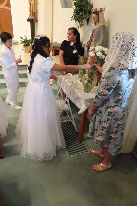 After First Communion the communicants participated in a the Crowning of the Blessed Virgin Mary at St. Philip the Apostle in Statesville. (Photos provided by Connie Ries)