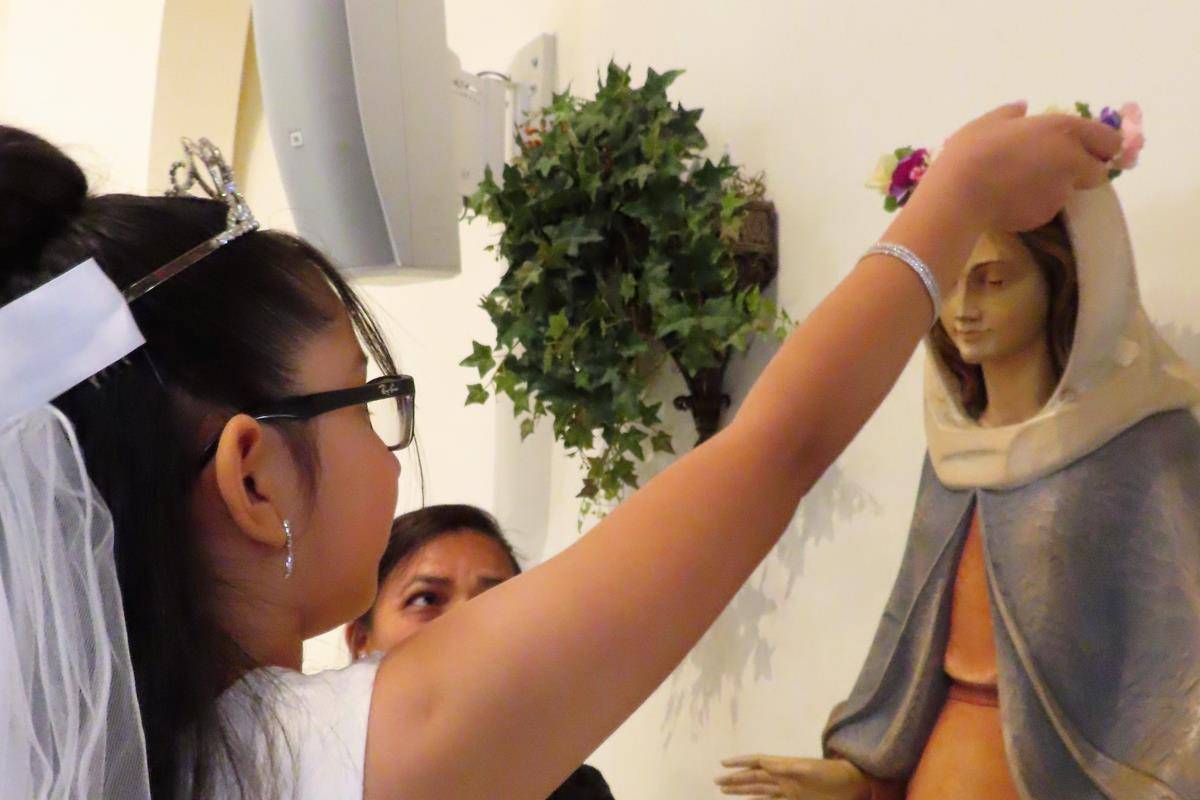 After First Communion the communicants participated in a the Crowning of the Blessed Virgin Mary at St. Philip the Apostle in Statesville. (Photos provided by Connie Ries)