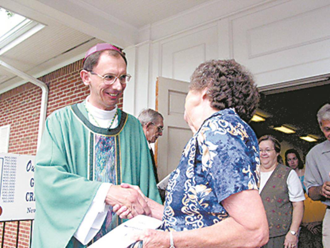 Bishop Jugis greets well wishers at Our Lady of Lourdes Parish in 2003, his last pastoral assignment before becoming bishop.