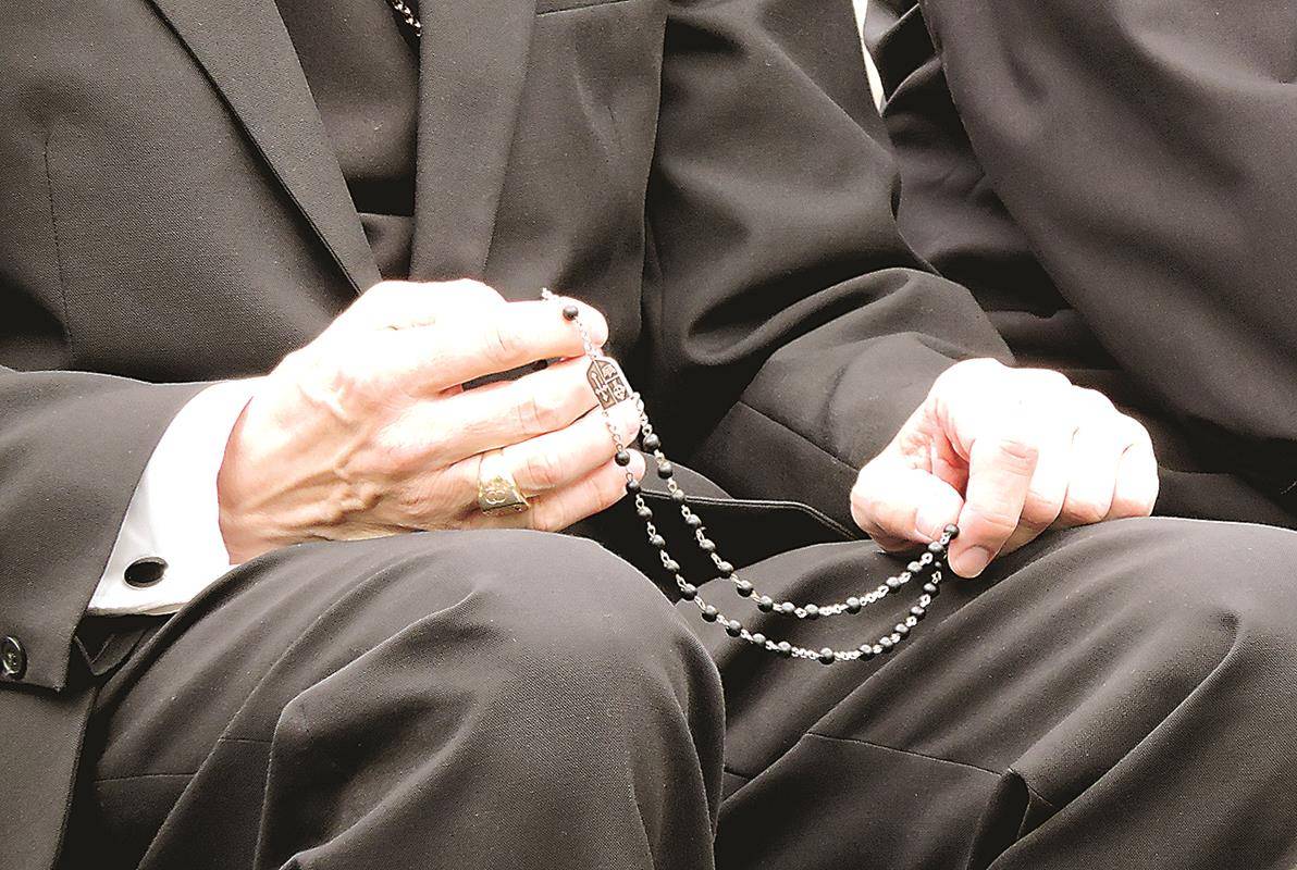 Bishop praying rosary (Copy)