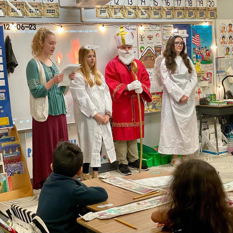 In Greensboro, St. Nicholas visited Our Lady of Grace school classrooms, accompanied by two angels and a peasant girl who shared his story with our students. 