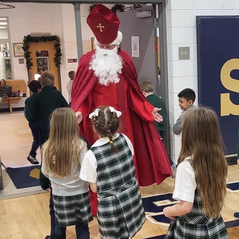 The students left their shoes outside of their classrooms during the assembly and, much to their delight, found that St. Nicholas had left each of them a treat!