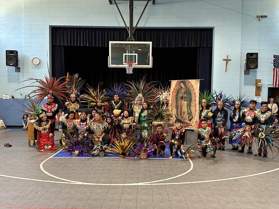 At Asheville Catholic School they celebrated the Feast of Our Lady of Guadalupe by by inviting the Aztec Dancers to perform. The performers include Latino community members as well as current and former ACS students.