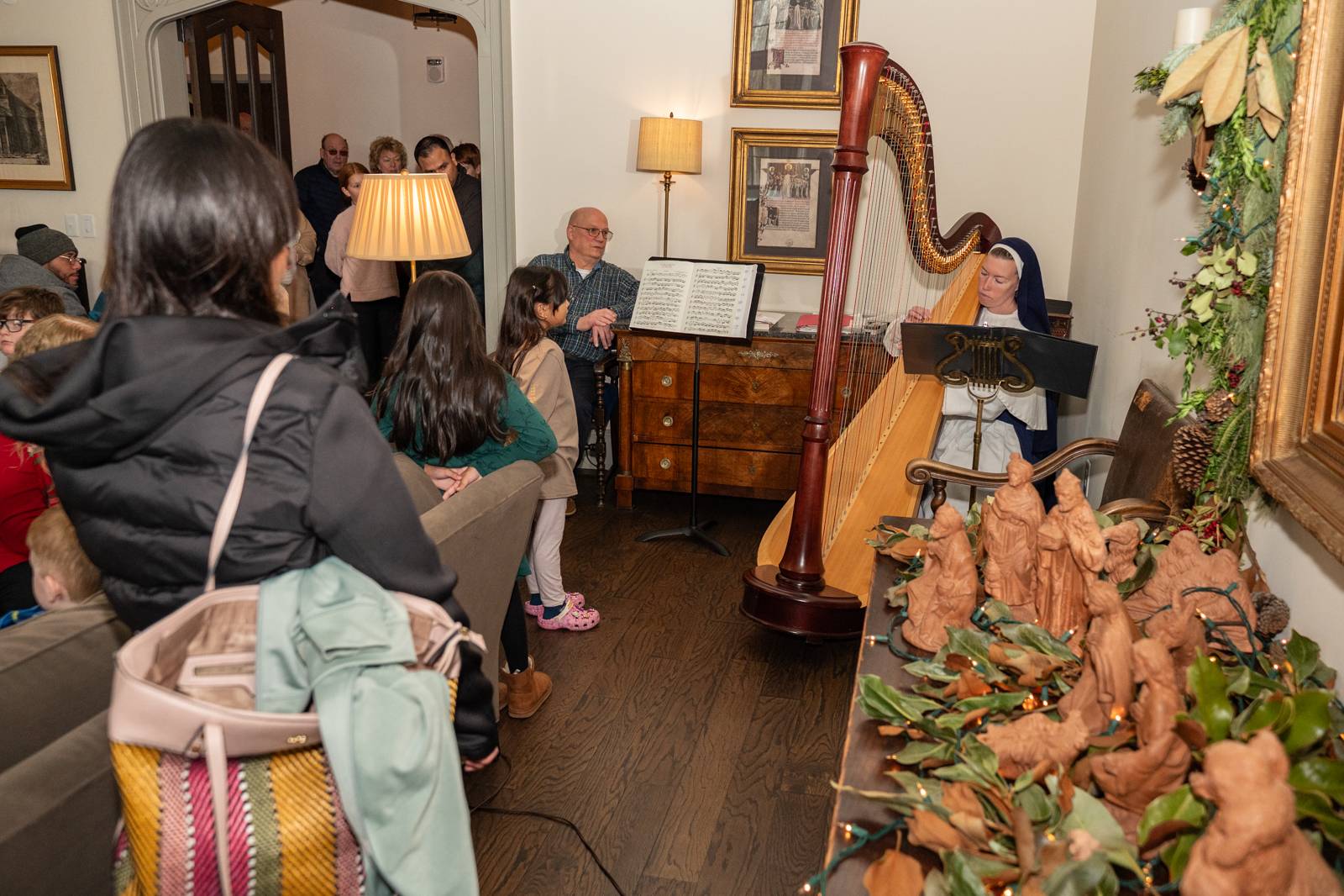 Sister Mary Raphael played the harp in the seminary's music room.
