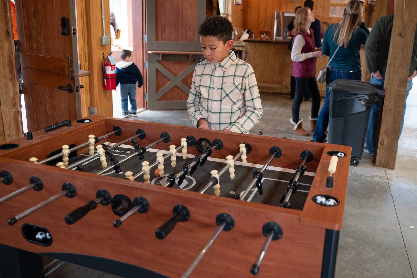 Enjoying foosball in the seminary barn.