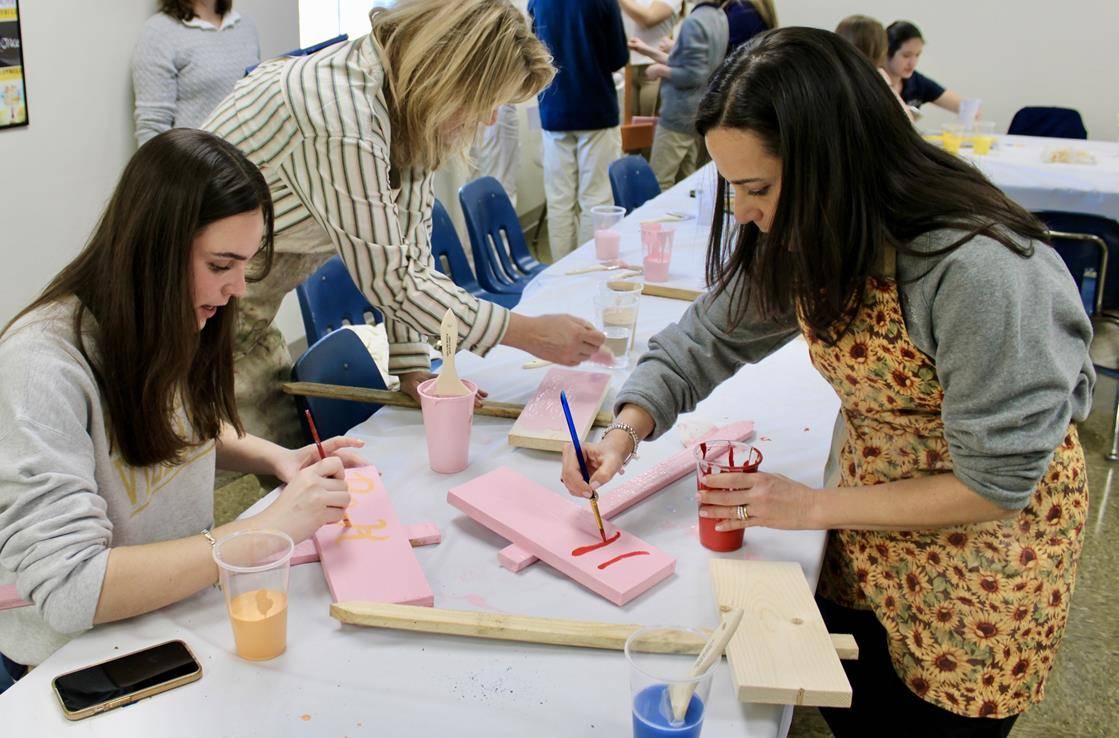 Bishop McGuinness students also painted signs with messages of hope that were displayed on campus and given to local community organizations.