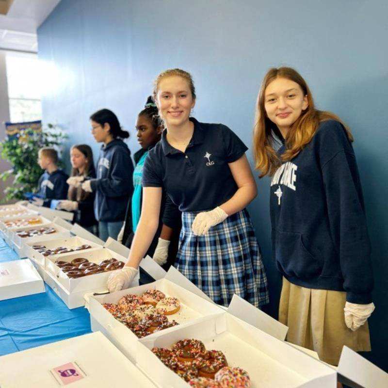 The students took the lead in engaging in acts of service. Following the Mass service, parishioners gathered for a Donut Social. 