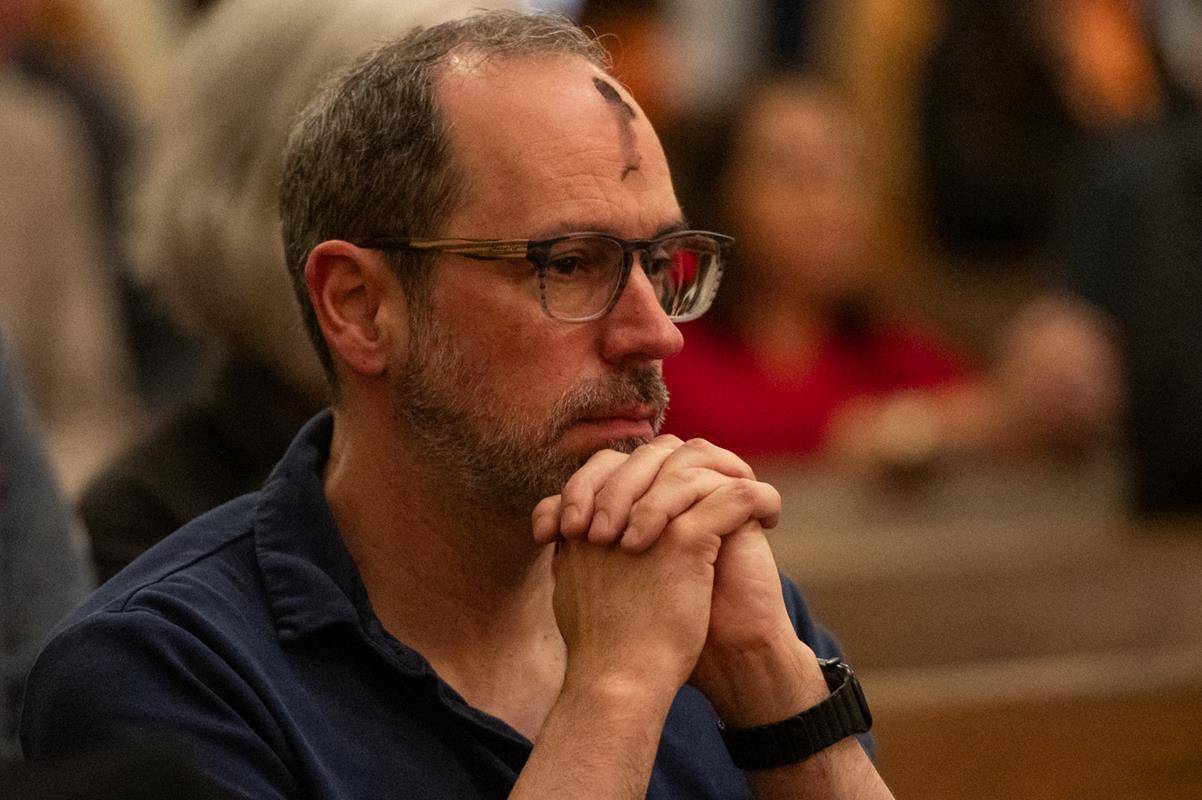 Faithful attend the 7:30 a.m. Ash Wednesday Mass at St. Peter Church in Charlotte. 