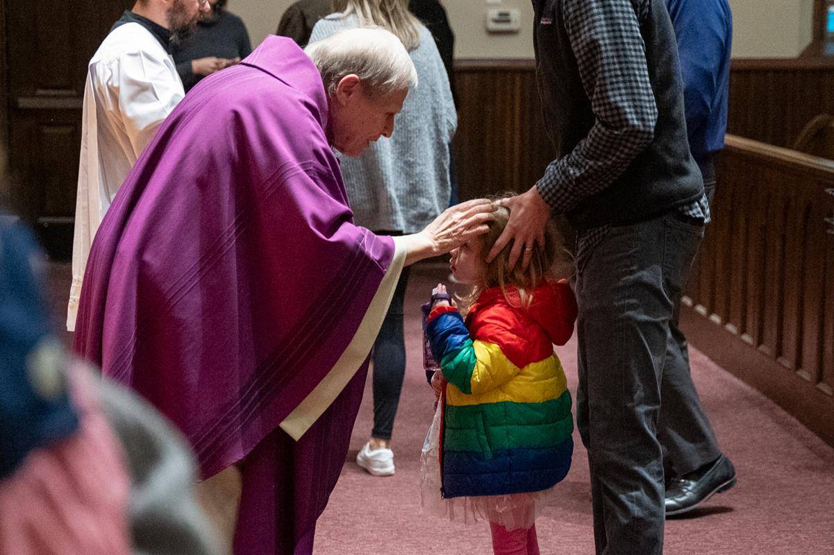Faithful attend the 7:30 a.m. Ash Wednesday Mass at St. Peter Church in Charlotte. 