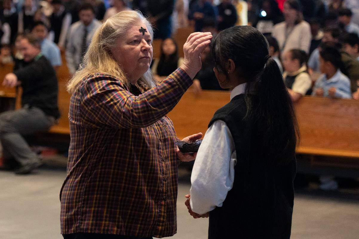 Father Victor Ameh, a priest of the Missionary Society of St. Paul of Nigeria, newly assigned to Our Lady of the Assumption in Charlotte celebrated Ash Wednesday Mass with students from Our Lady of the Assumption School. 