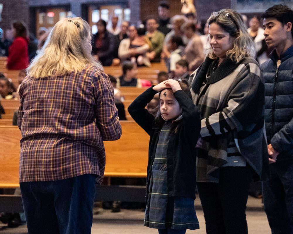 Father Victor Ameh, a priest of the Missionary Society of St. Paul of Nigeria, newly assigned to Our Lady of the Assumption in Charlotte celebrated Ash Wednesday Mass with students from Our Lady of the Assumption School. 
