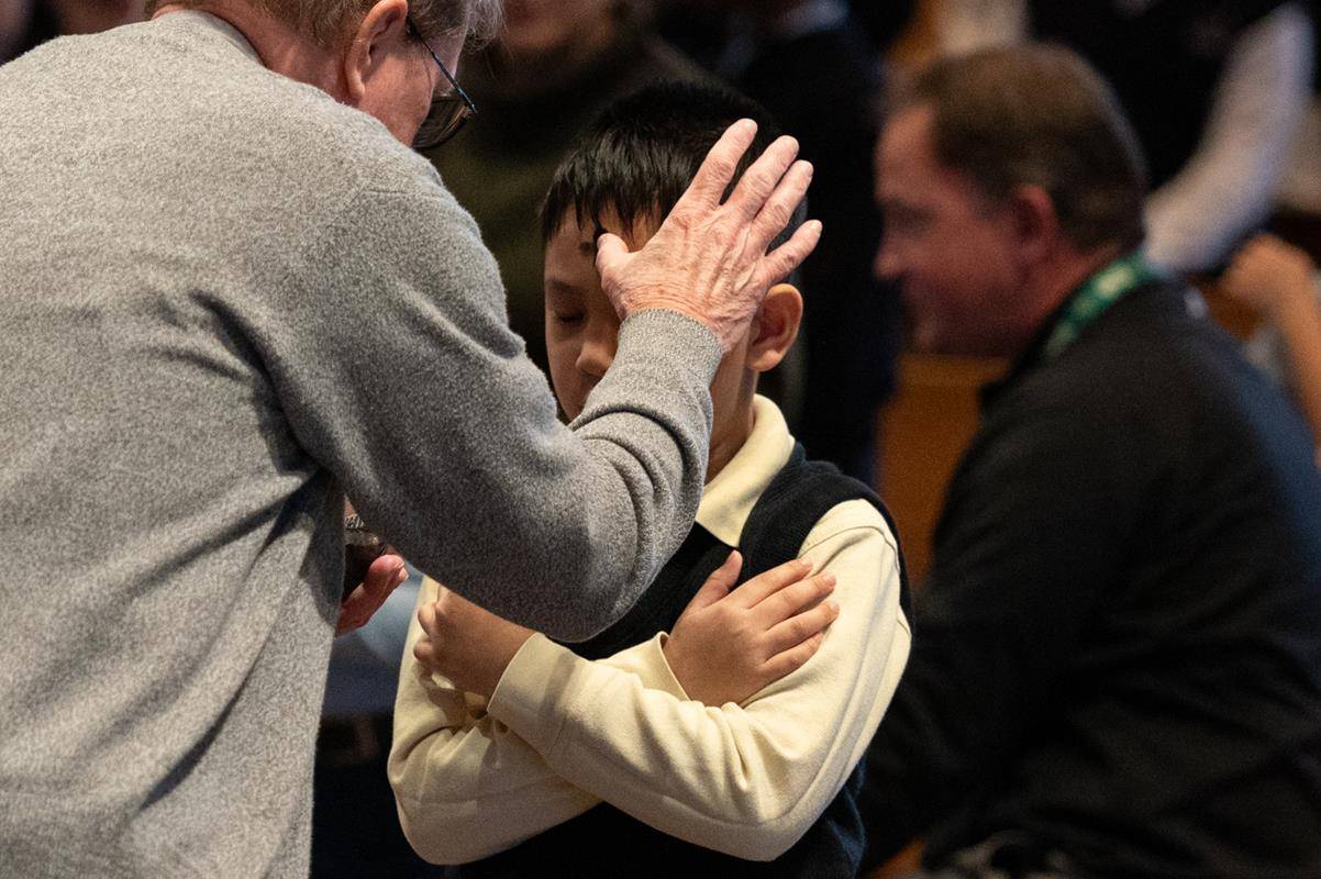 Father Victor Ameh, a priest of the Missionary Society of St. Paul of Nigeria, newly assigned to Our Lady of the Assumption in Charlotte celebrated Ash Wednesday Mass with students from Our Lady of the Assumption School. 