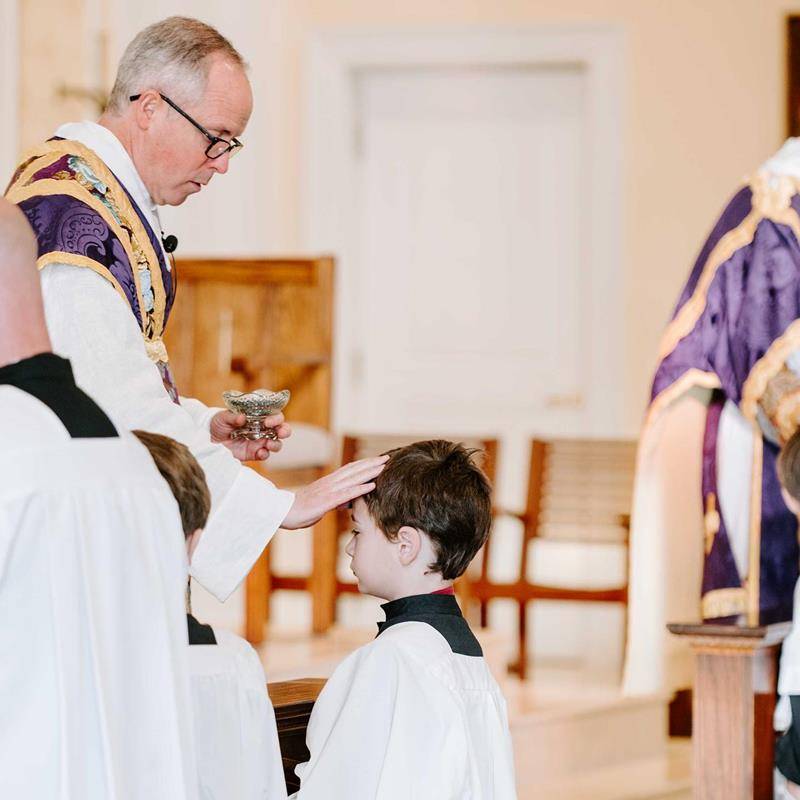 Father Timothy Reid celebrated Ash Wednesday Mass for St. Ann School students at St. Ann Church in Charlotte.