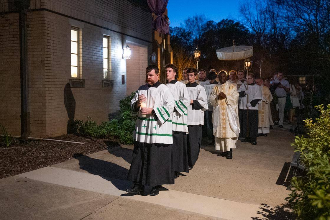 The congregation at St. Patrick Cathedral processes to the altar of repose.