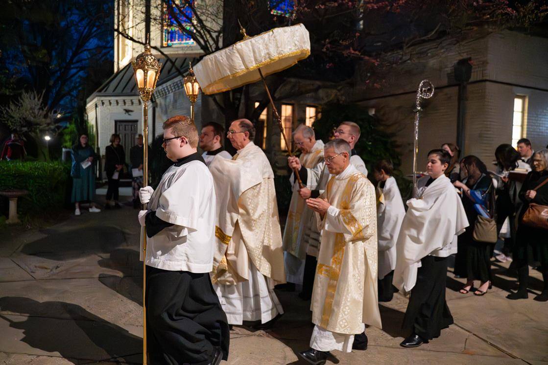 The congregation at St. Patrick Cathedral processes to the altar of repose.