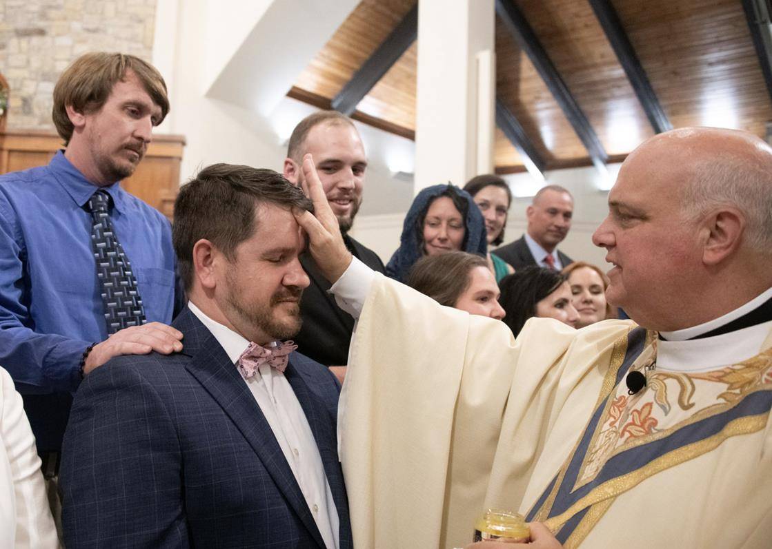 Ben Garrison, who was formerly studying in a Wesleyan seminary, joined the Catholic Church at St. Pius X in Greensboro.