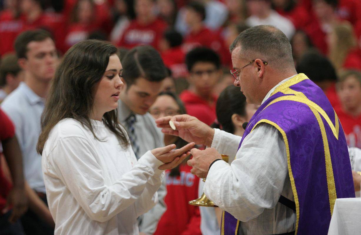 Students at Charlotte Catholic High School during Mass on Ash Wednesday