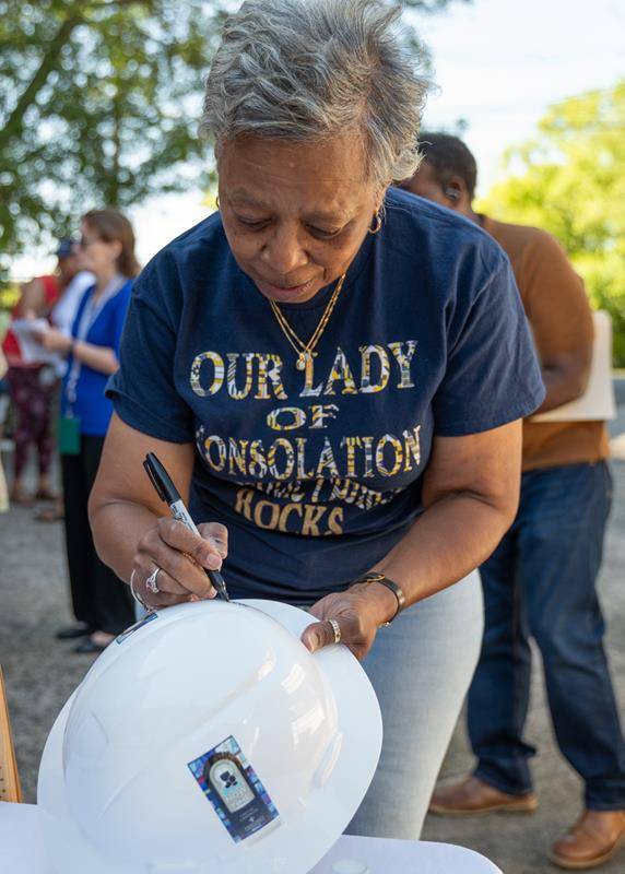 Members of the church signed hard hats.