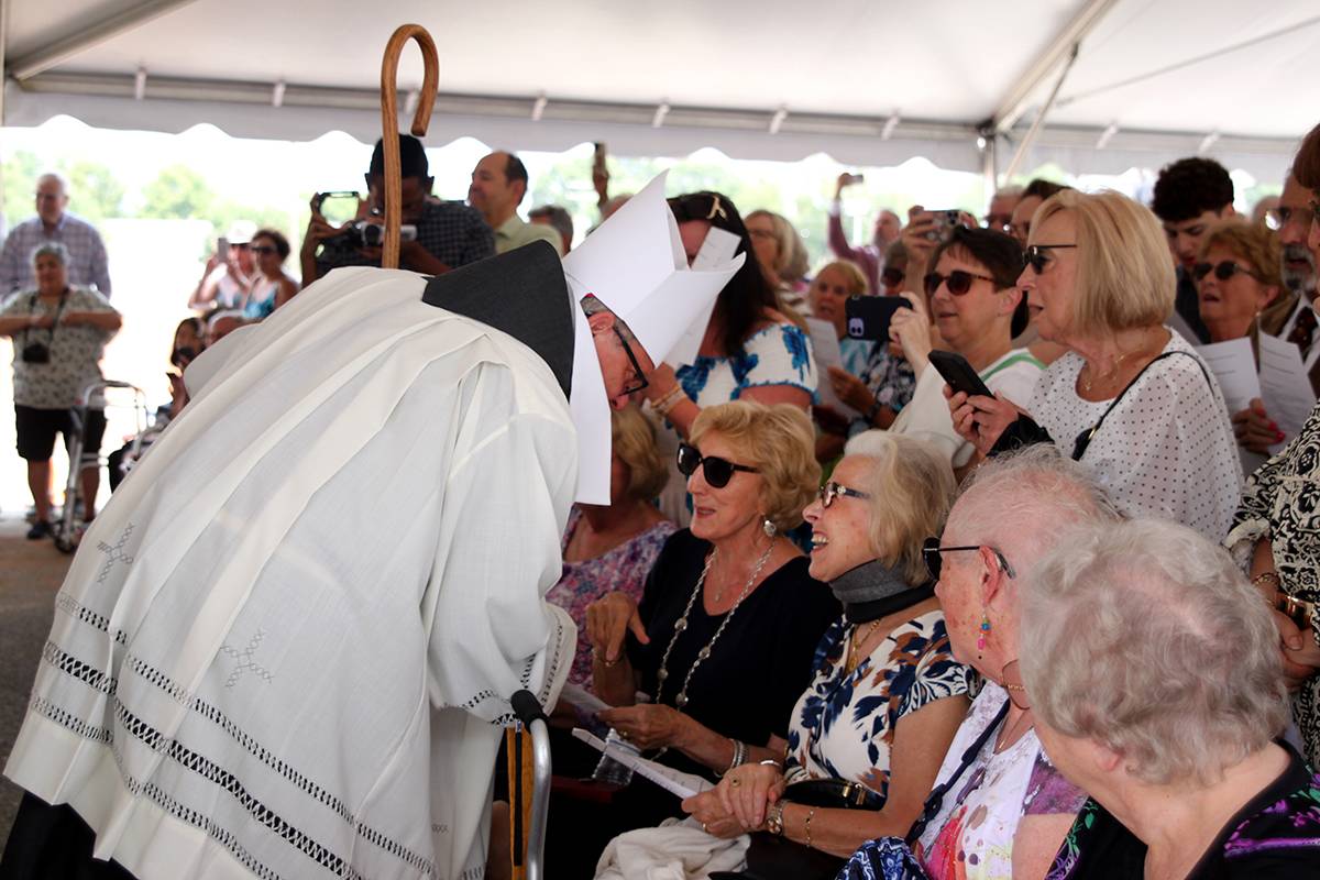Bishop Michael Martin took time to greet parishioners, especially the elderly and people with restricted mobility.