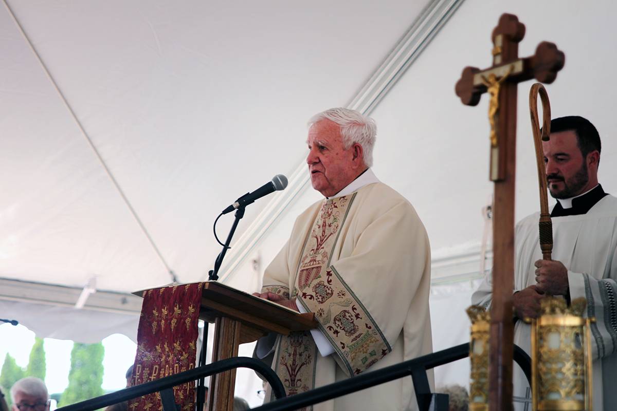 Deacon Matt Reilly reads the Gospel during the special liturgy.