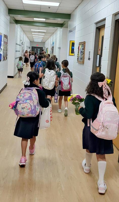 Students arrive for the first day at St. Mark School in Huntersville.