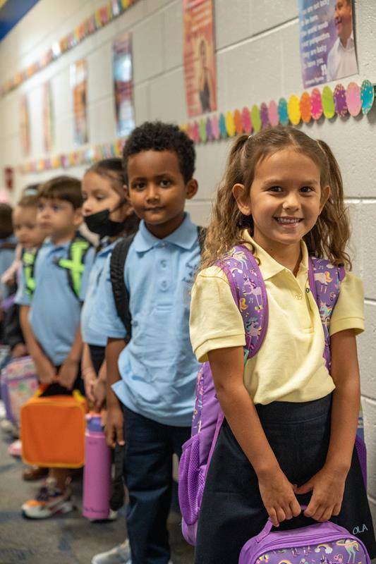 Students are excited to start classes on the first day of school at Our Lady of the Assumption School in Charlotte.