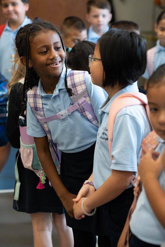 Students are excited to start classes on the first day of school at Our Lady of the Assumption School in Charlotte.