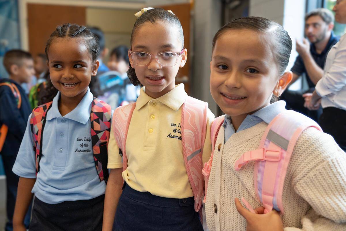 Students are excited to start classes on the first day of school at Our Lady of the Assumption School in Charlotte.