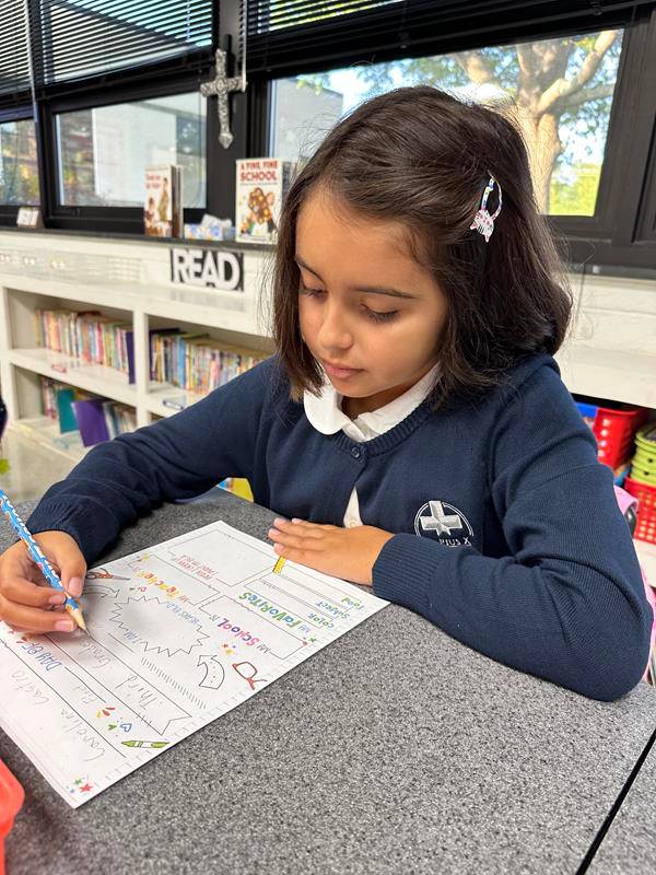 Students smile as they arrive at St. Pius X School in Greensboro for the first day of school.