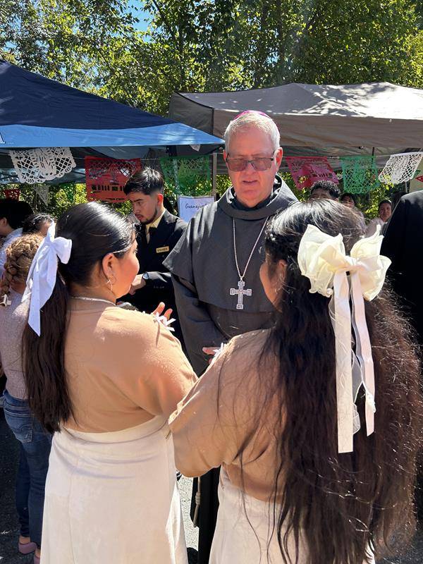 091224-Bishop greets OLH parishioners