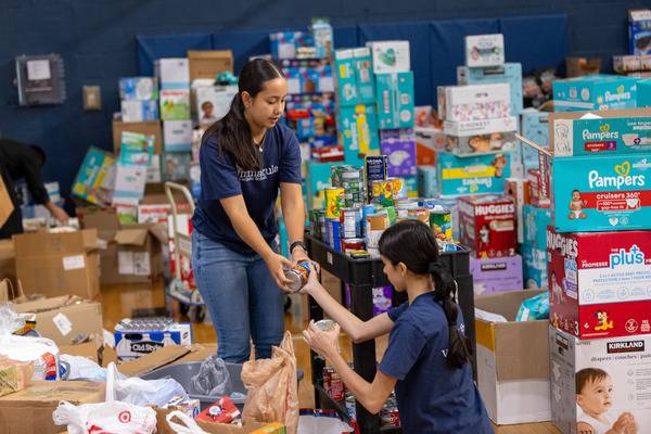 Immaculata's gym has become a warehouse and sorting facility for incoming aid. (Gabriel Swinney)