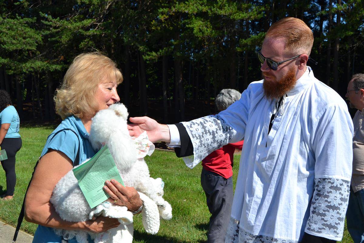 Father Noah Carter blesses animals at Holy Cross Church in Kernersville.