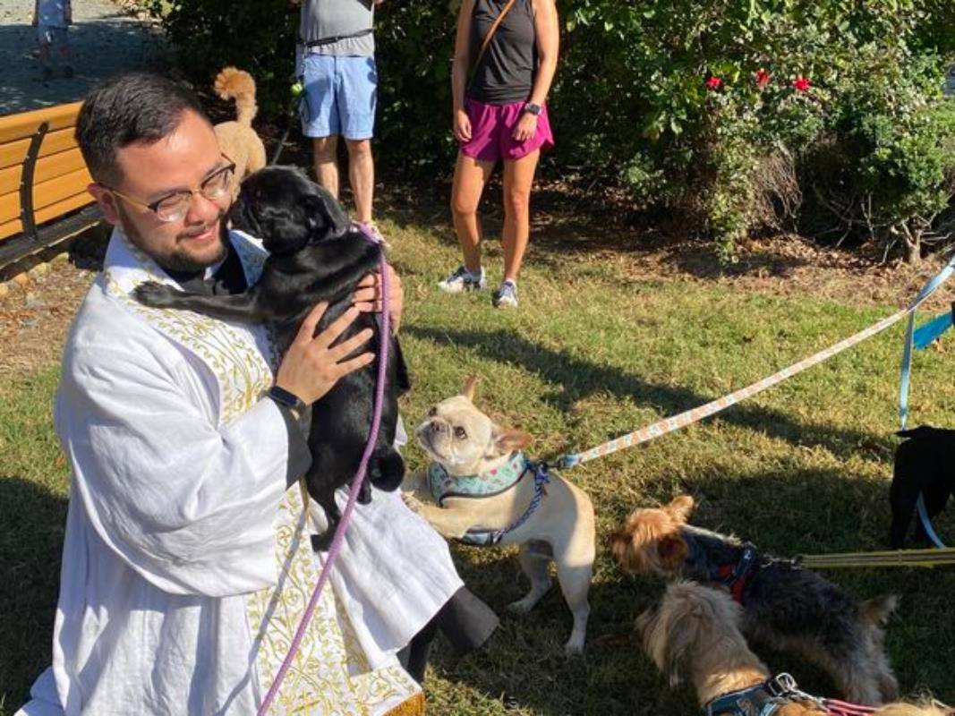 Father Kevin Tran blesses pets at St. Gabriel Church in Charlotte.