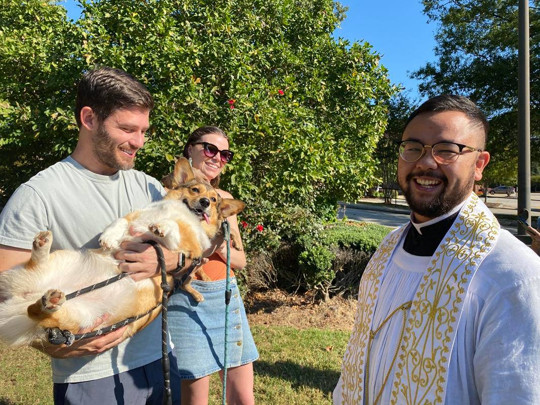 Father Kevin Tran blesses pets at St. Gabriel Church in Charlotte.