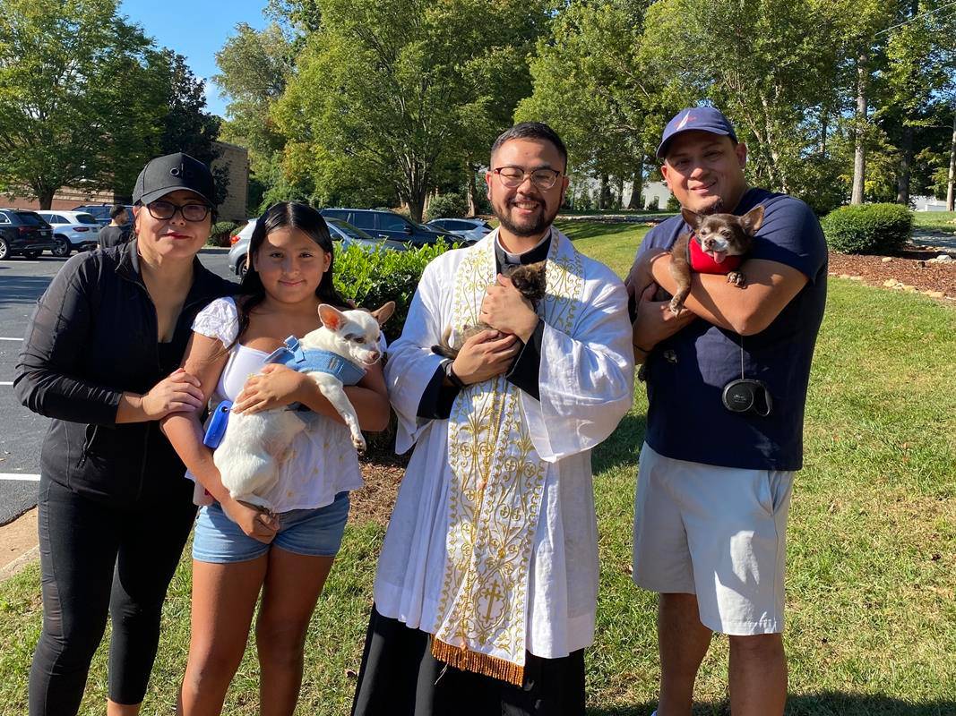 Father Kevin Tran blesses pets at St. Gabriel Church in Charlotte.