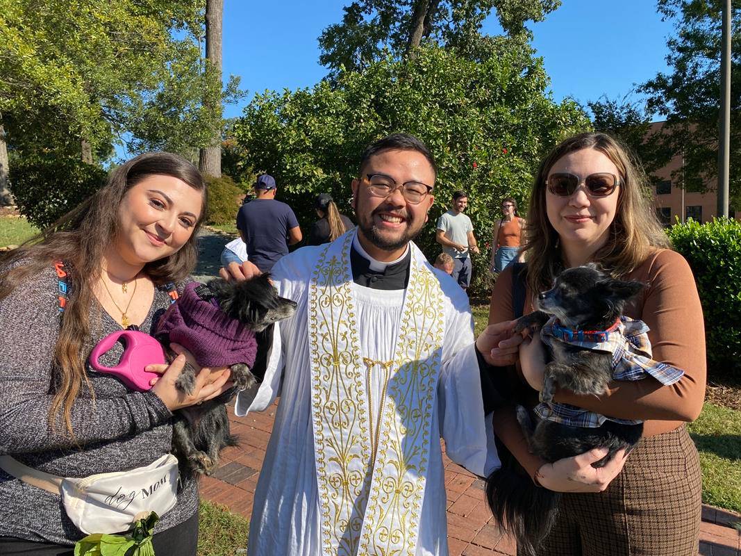 Father Kevin Tran blesses pets at St. Gabriel Church in Charlotte.