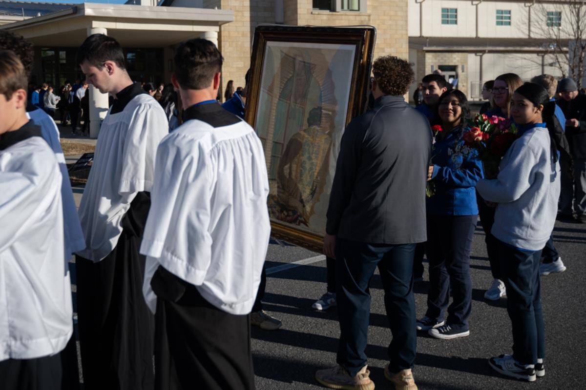 Christ the King High School students processed to the gym for Mass.