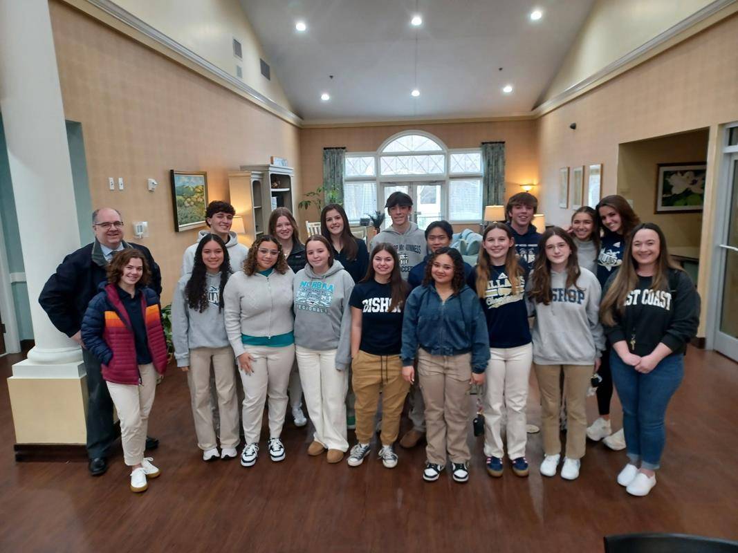 Bishop McGuinness High School student baked homemade cookies, cleaned around the house, chalked the walk, and made welcome cards for SECU Family House of Winston Salem. 