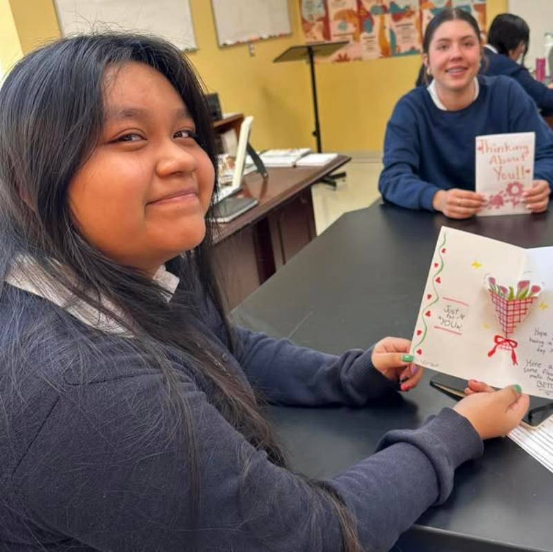 Immaculata Catholic School students during Catholic Schools Week have collected pet food for an animal shelter, made cards for homebound parishioners, and spent time reading together.