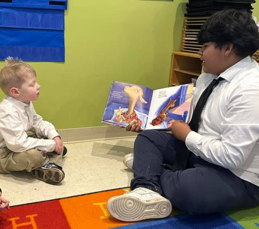 Immaculata Catholic School students during Catholic Schools Week have collected pet food for an animal shelter, made cards for homebound parishioners, and spent time reading together.